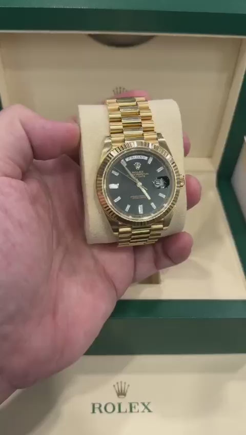 gold rolex black face